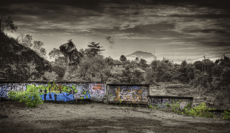 I took this shot while waiting out a traffic jam. The Jimbaran hills overlook Kuta, while Mount Agung looms in the background.